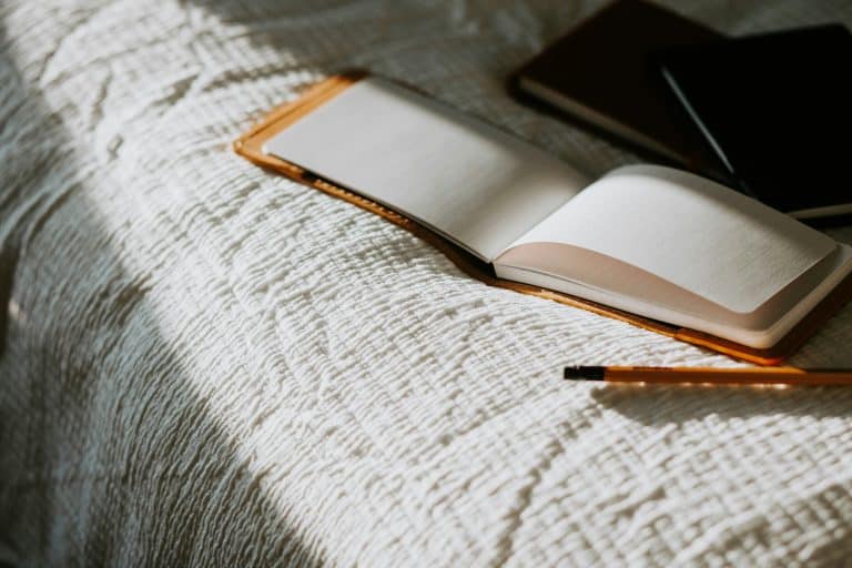 An empty notebook inviting reflection
