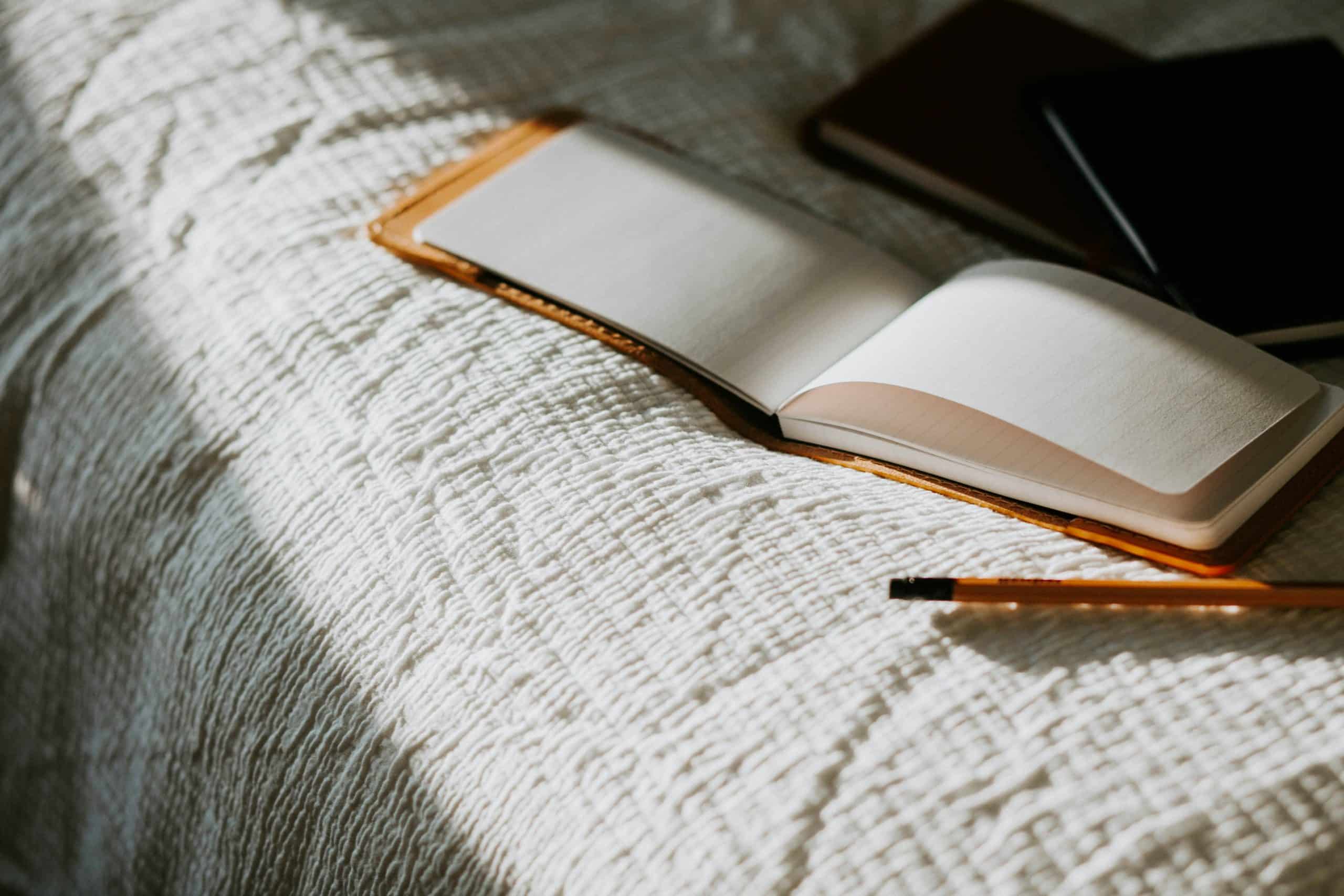 An empty notebook inviting reflection